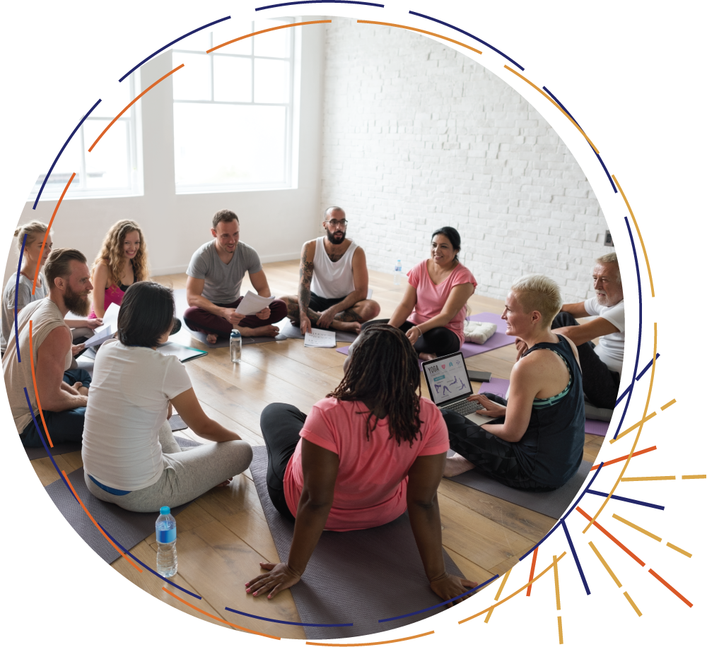 first light living, group training, picture of a group sitting on floor in a circle at a course