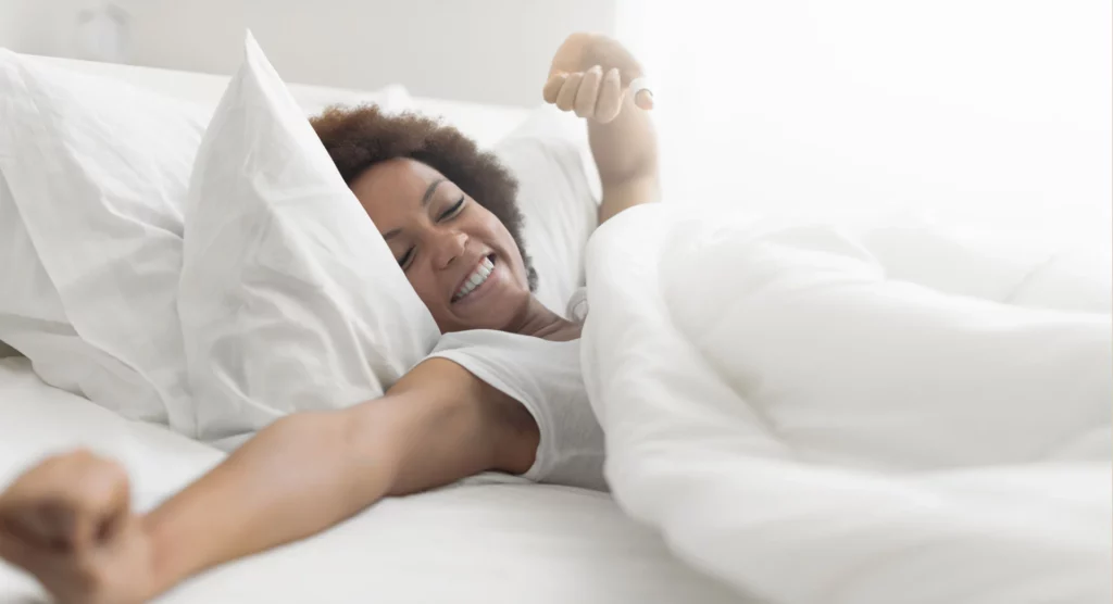 first light living, well rested image, girl waking up from a great sleep in white comfy bed